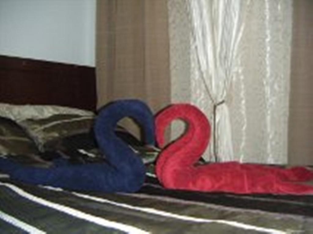 The Oasis Davao Condotel Room photo