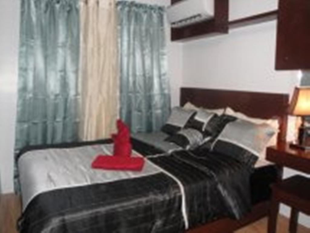 The Oasis Davao Condotel Room photo