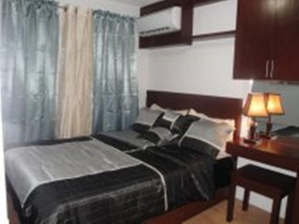 The Oasis Davao Condotel Room photo